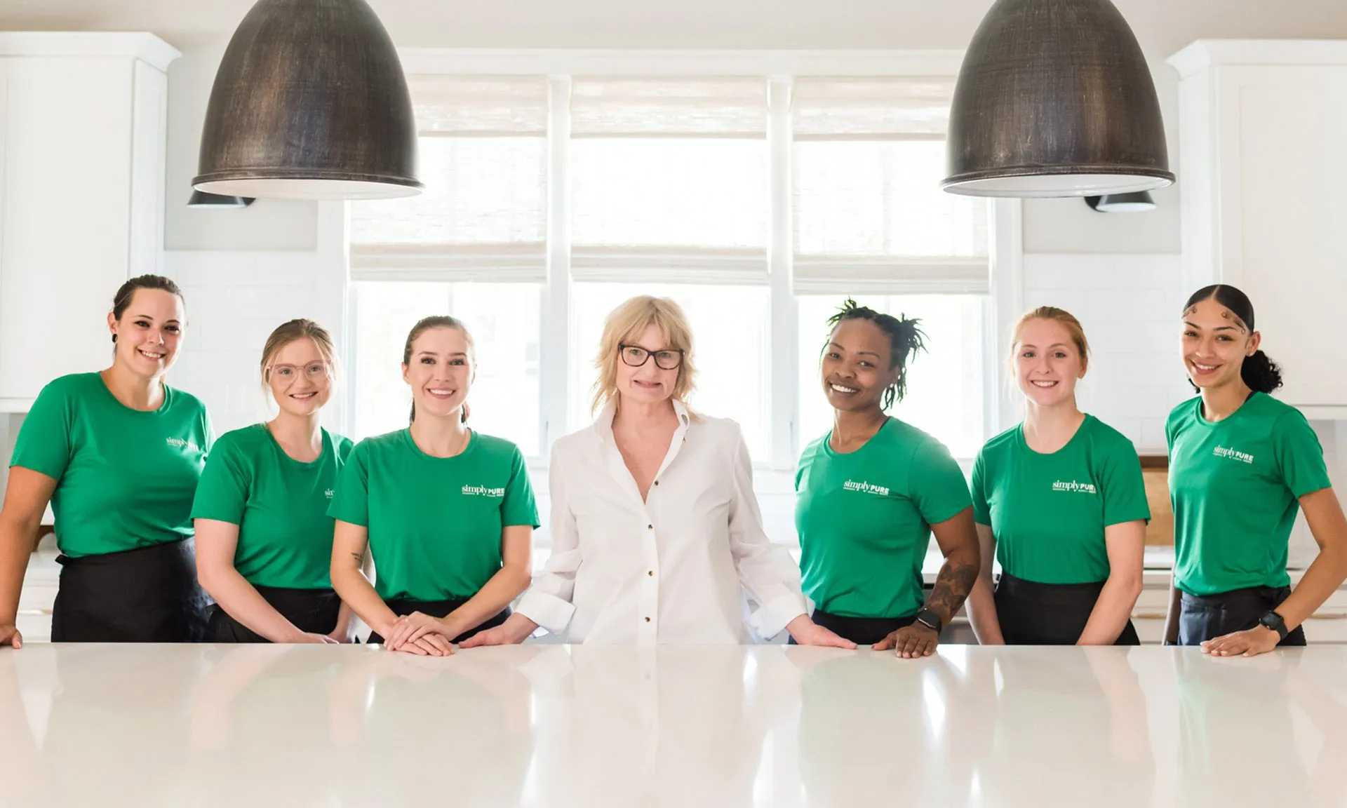 Simply Pure Home Cleaning team standing in kitchen